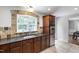 Kitchen boasting granite counters, stone backsplash, stainless appliances, and a window view at 7009 Brecken Ridge Ave, Raleigh, NC 27615