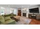 Comfortable living room with fireplace, hardwood floors, and ample seating for relaxation at 7009 Brecken Ridge Ave, Raleigh, NC 27615