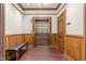 Elevator lobby with wood paneling, decorative trim, an elevator, and a leather bench offers an inviting space at 710 Independence Pl # 301, Raleigh, NC 27603