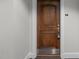 Elegant wooden front door with unit number and detailed trim creates a welcoming entry at 710 Independence Pl # 301, Raleigh, NC 27603