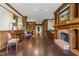Grand lobby with a fireplace, dark wood floors, trim, columns and paneled walls with decorative furnishing and accents at 710 Independence Pl # 301, Raleigh, NC 27603