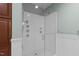 Modern shower with white tiles, multiple shower heads, and a clear glass door offers a sleek design at 710 Independence Pl # 301, Raleigh, NC 27603