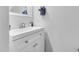 Well lit white sink with silver faucet and white cabinets at 7365 Sandy Creek Dr, Raleigh, NC 27615