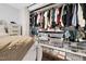 Organized walk-in closet with clothing racks, shelving, and ample storage space at 7365 Sandy Creek Dr, Raleigh, NC 27615