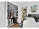 Bedroom closet with clothing, luggage, and custom organizers at 7365 Sandy Creek Dr, Raleigh, NC 27615