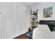 Bedroom closet with sliding doors, built-in shelving, and views of the accent painting at 7365 Sandy Creek Dr, Raleigh, NC 27615