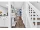 Hallway features wood floors, stairs, and decor at 7365 Sandy Creek Dr, Raleigh, NC 27615