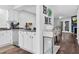 Cozy entryway featuring wood floors and view into the open living area at 7365 Sandy Creek Dr, Raleigh, NC 27615