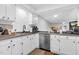 Bright kitchen with stainless steel dishwasher and stylish white cabinetry at 7365 Sandy Creek Dr, Raleigh, NC 27615