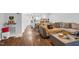 Comfortable living room with hardwood floors and an open floor plan leading into dining room and kitchen at 7365 Sandy Creek Dr, Raleigh, NC 27615
