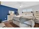 Comfortable main bedroom featuring neutral tones, wood-look floors, and modern furnishings at 7365 Sandy Creek Dr, Raleigh, NC 27615