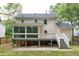 Exterior home view shows a backyard and sunroom at 8116 Bentwood Pl, Raleigh, NC 27615