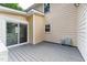 Backyard deck with sliding glass doors, offers outdoor living space and access to the screened porch at 8116 Bentwood Pl, Raleigh, NC 27615