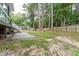 Landscaped backyard boasts mature trees, privacy fence, and a hammock at 8116 Bentwood Pl, Raleigh, NC 27615
