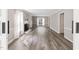 Bright living room features a fireplace, large window, and hardwood floors at 8116 Bentwood Pl, Raleigh, NC 27615