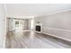 Spacious living room featuring a fireplace, sliding doors, and hardwood floors at 8116 Bentwood Pl, Raleigh, NC 27615