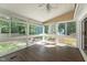 Sunroom features a ceiling fan, vaulted ceiling, and lots of windows at 8116 Bentwood Pl, Raleigh, NC 27615