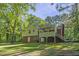 Back exterior showcasing the deck, yard, and access to home at 821 Stoneybrook Dr, Sanford, NC 27330
