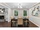 Elegant dining room with a modern chandelier and ample natural light at 821 Stoneybrook Dr, Sanford, NC 27330