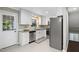 Well-lit, stylish kitchen with stainless steel appliances and tiled backsplash at 821 Stoneybrook Dr, Sanford, NC 27330