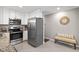 Well-lit kitchen with stainless steel appliances and granite countertops at 821 Stoneybrook Dr, Sanford, NC 27330