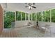The screened porch has lots of light and is perfect for enjoying nature at 821 Stoneybrook Dr, Sanford, NC 27330