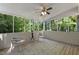 Screened porch with comfortable seating, perfect for relaxation at 821 Stoneybrook Dr, Sanford, NC 27330