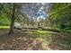Lush backyard with mature trees at 8635 Old Us 421 S, Bear Creek, NC 27207