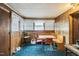Dining room featuring natural light and wood paneling at 8635 Old Us 421 S, Bear Creek, NC 27207