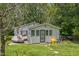 Side view of the home showing the natural landscape at 8635 Old Us 421 S, Bear Creek, NC 27207