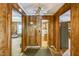 Hallway features wood paneling and leads to various rooms at 8635 Old Us 421 S, Bear Creek, NC 27207