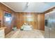 Expansive kitchen with wood paneling, stainless steel fridge, and ample storage space at 8635 Old Us 421 S, Bear Creek, NC 27207