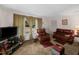 Inviting living room boasting comfortable seating, soft carpet, and ample natural light at 8635 Old Us 421 S, Bear Creek, NC 27207