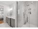 Modern bathroom featuring a glass-enclosed shower, dual sink vanity, and elegant finishes for a spa-like experience at 911 Canterbury Rd, Raleigh, NC 27607
