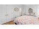 Comfortable bedroom featuring a bed, stylish decor, and a pair of closets at 911 Canterbury Rd, Raleigh, NC 27607