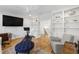 Bonus room with a built-in bookshelf, work out equipment and hardwood floors at 911 Canterbury Rd, Raleigh, NC 27607
