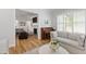 Open-concept living area with seamless transitions, featuring hardwood floors, fireplace, and ample space for relaxation and entertainment at 911 Canterbury Rd, Raleigh, NC 27607