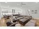 Open-concept living space with kitchen, and cozy seating area with a large sectional sofa at 911 Canterbury Rd, Raleigh, NC 27607