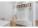 Bright mudroom features built-in storage, coat hooks, and a bench, offering practical entryway organization at 911 Canterbury Rd, Raleigh, NC 27607