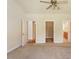 Spacious bedroom with neutral walls and carpet, offering multiple access points at 9112 Mission Hills Ct, Raleigh, NC 27617