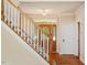 Beautiful entrance featuring a wood door with decorative glass and stairway at 9112 Mission Hills Ct, Raleigh, NC 27617