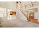 Open-concept living room showcasing stairway, entrance, and eat-in kitchen at 9112 Mission Hills Ct, Raleigh, NC 27617