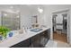 Bathroom with double vanity, tiled shower, and walk-in closet access at 1010 Sandbar Ln, Durham, NC 27703