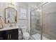 Modern bathroom featuring a glass-enclosed shower, vanity with sink, and neutral color palette at 1010 Sandbar Ln, Durham, NC 27703