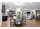 Open dining area with hardwood floors and decorative chandelier at 1010 Sandbar Ln, Durham, NC 27703