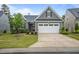 Attractive one-story home featuring a two car garage, neat landscaping, and a well-maintained lawn at 1010 Sandbar Ln, Durham, NC 27703