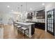 Open concept kitchen with granite counters, large island and stainless steel appliances at 1010 Sandbar Ln, Durham, NC 27703