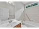 Bathroom with a vanity, sink, and a tub-shower combination with tiled walls at 103 Kylie Savannah Ct, Cary, NC 27511