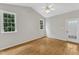 Spacious bedroom with hardwood floors, vaulted ceiling, and natural light at 103 Kylie Savannah Ct, Cary, NC 27511