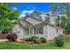 Beautiful home exterior featuring manicured lawn and mature trees at 103 Kylie Savannah Ct, Cary, NC 27511